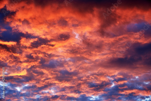 Red clouds at sunset, fire on black background © Igor Ullman
