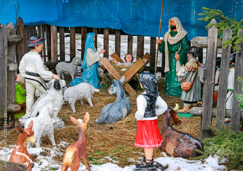 KRAKOW, POLAND - DECEMBER 25, 2018: Traditional Christmas decorations, nativity scene with old wooden figurines