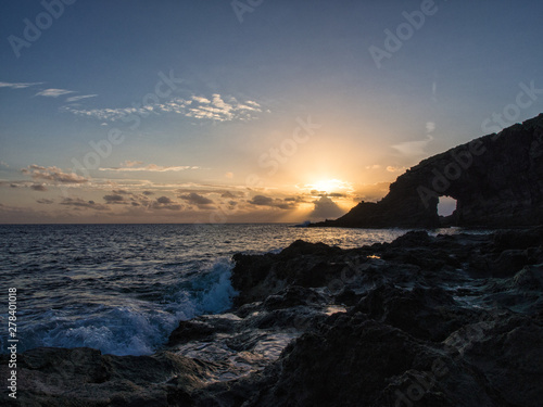 sunrise at the elephant arch of the island of Pantelleria, Italy