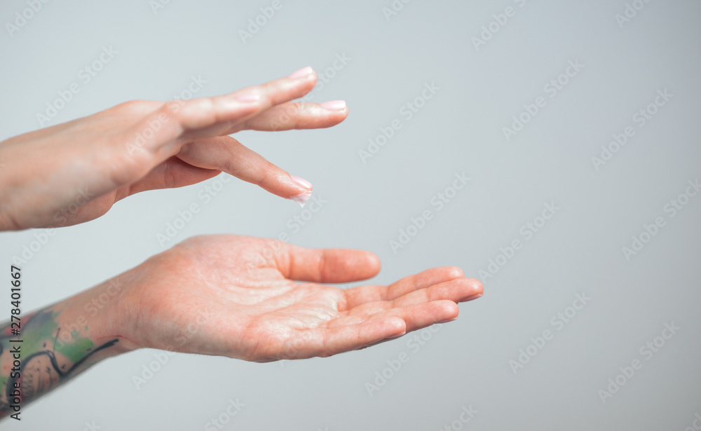 Fingers apply cream to skin. Close up Fingers apply cream to skin. Close up