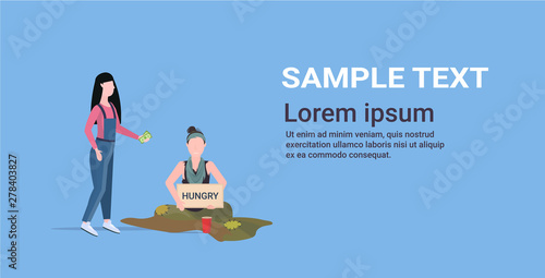 girl giving money to sad woman beggar holding sign board with hungry text girl tramp begging for help homeless concept flat full length horizontal copy space