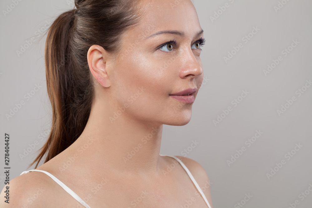Beautiful female face. Healthy model with clear skin. Skincare and facial treatment concept Beautiful female face. Healthy model with clear skin. Skincare and facial treatment concept