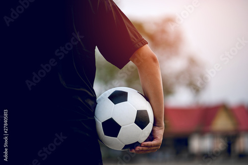 The cropped image of sports players who catch the ball and the football field. Sports-image concept.