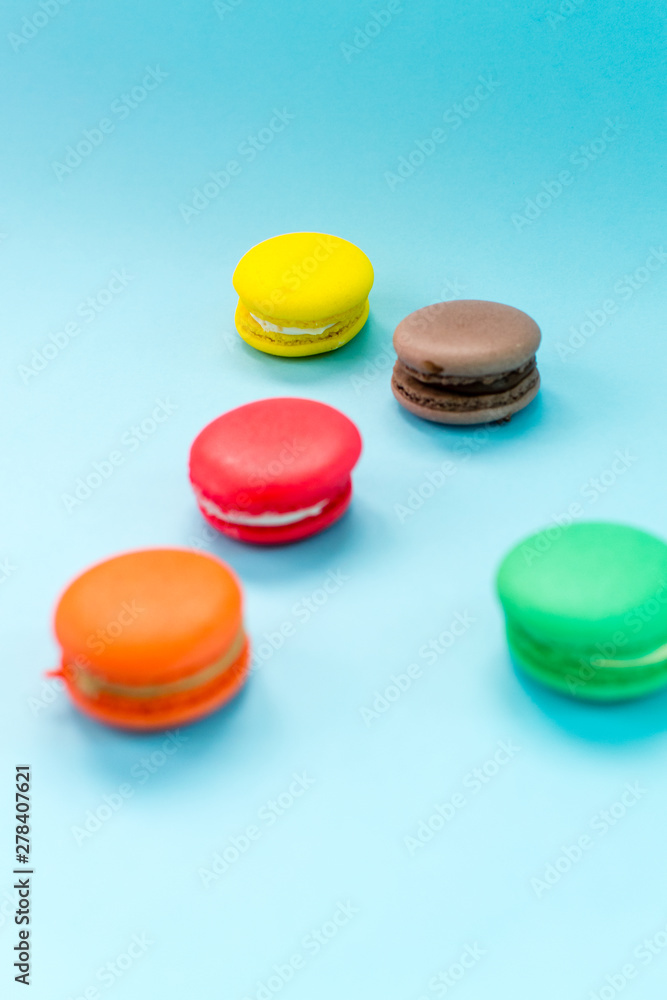 Close-up shot of colored macaroons in different position