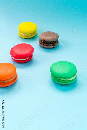 Close-up shot of colored macaroons in different position