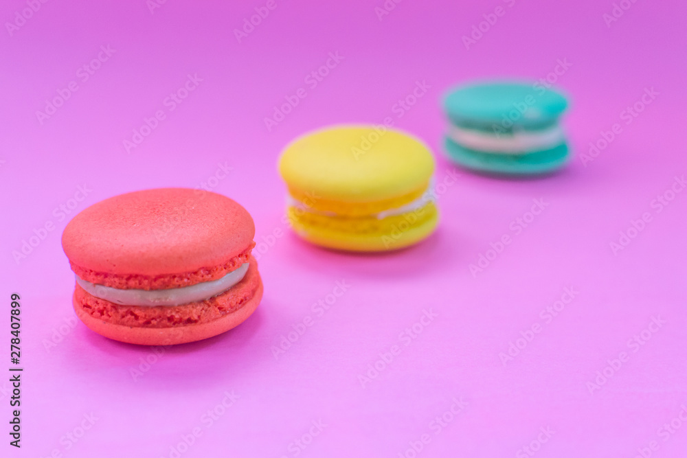Close-up shot of colored macaroons in different position Close-up shot of colored macaroons in different position