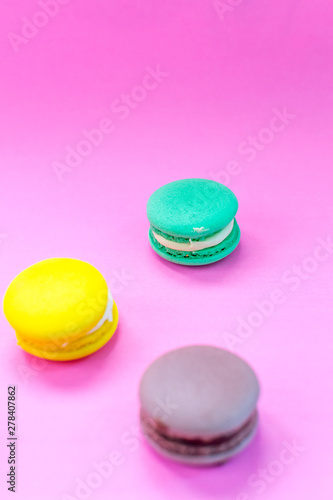 Close-up shot of colored macaroons in different position