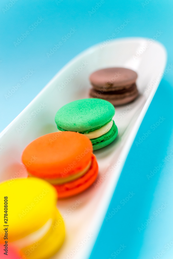 Close-up shot of colored macaroons in different position Close-up shot of colored macaroons in different position