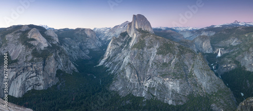 Half Dome and Yosemite Valley in Yosemite National Park during colorful sunset with trees and rocks. California, USA Sunny day in the most popular viewpoint in Yosemite. Beautiful landscape background © Michal