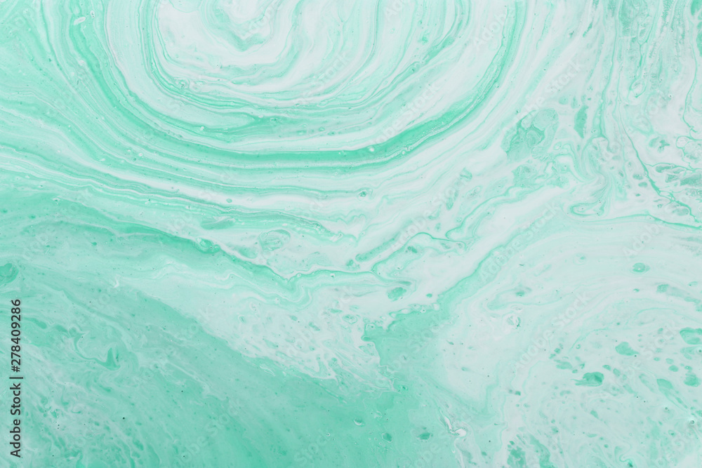 photography of abstract marbleized effect background. mint, green and white creative colors. Beautiful paint. banner