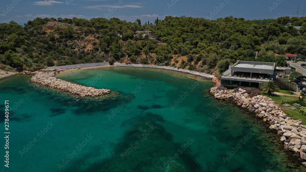 Aerial drone photo of rocky peninsula in Astir area or Asteras, Vouliagmenis, Attica, Greece