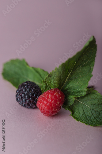 Mixed Raspberries And Blackberry With Leaves