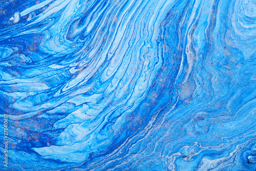 photography of abstract marbleized effect background. Blue and white creative colors. Beautiful paint.