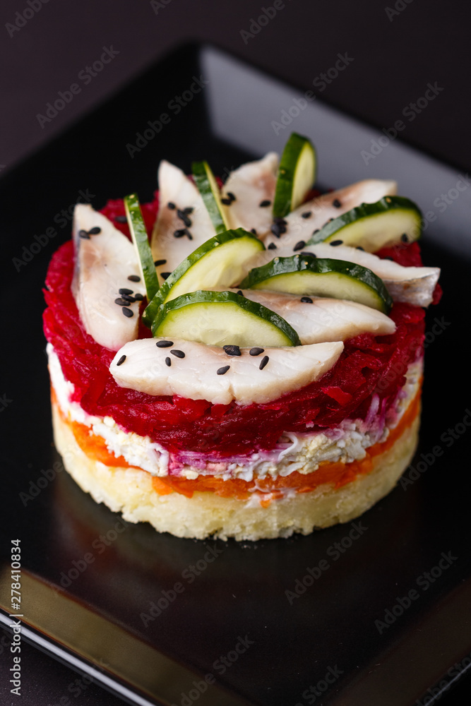 Russian salad herring under fur coat on a dark background Russian salad herring under fur coat on a dark background