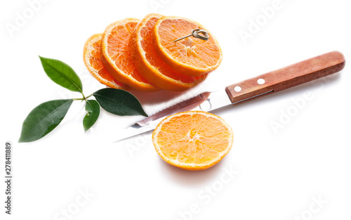 Juicy orange slices and kniffe isolated on white background. photo