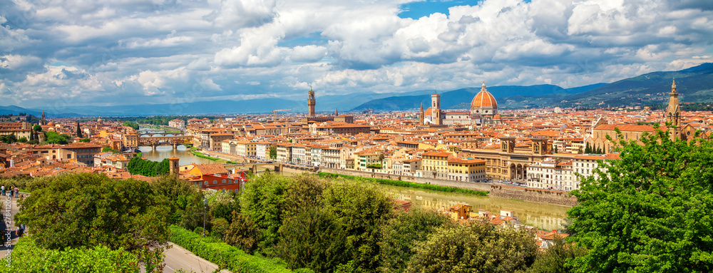  Panorama of Florence. Saint Mary of the Flower in Florence and medieval stone bridge Ponte Vecchio over Arno river in Florence, Tuscany, Italy. Florence cityscape. Florence architecture and landmark.