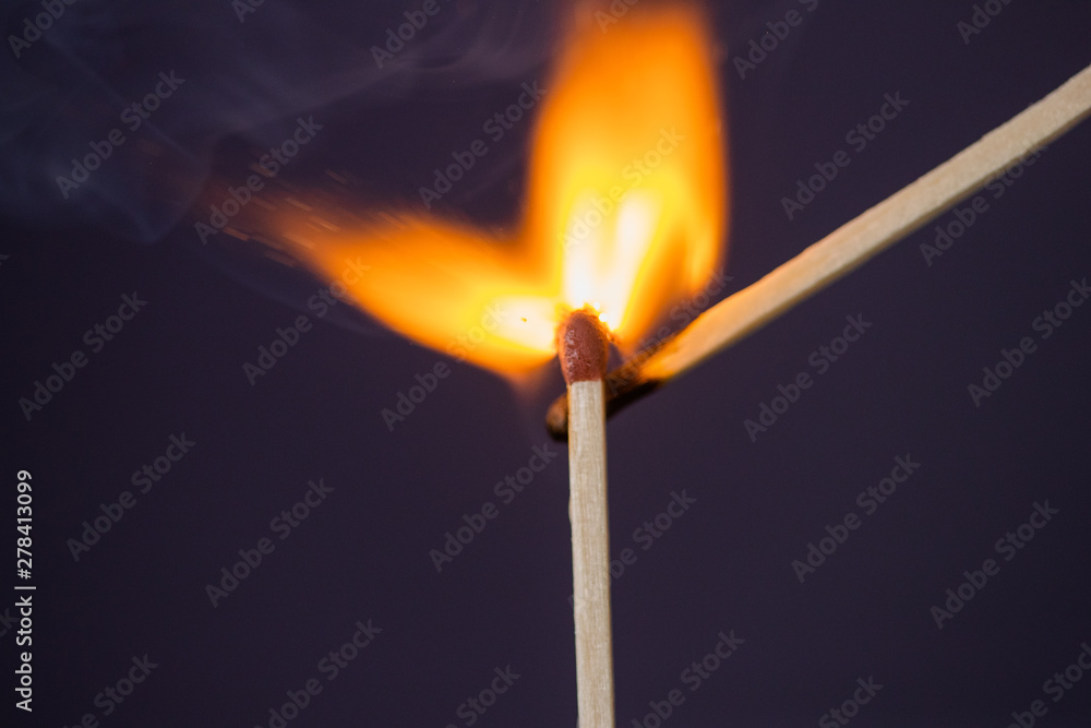 Close up Macro shot of a ignition match on a second match captured in super slow motion Close up Macro shot of a ignition match on a second match captured in super slow motion