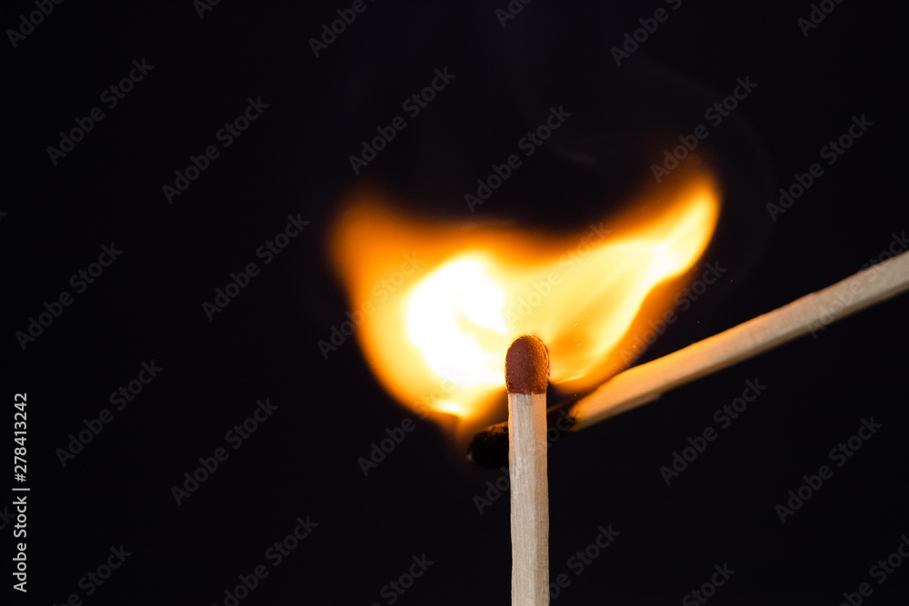 Close up Macro shot of a ignition match on a second match captured in super slow motion Close up Macro shot of a ignition match on a second match captured in super slow motion