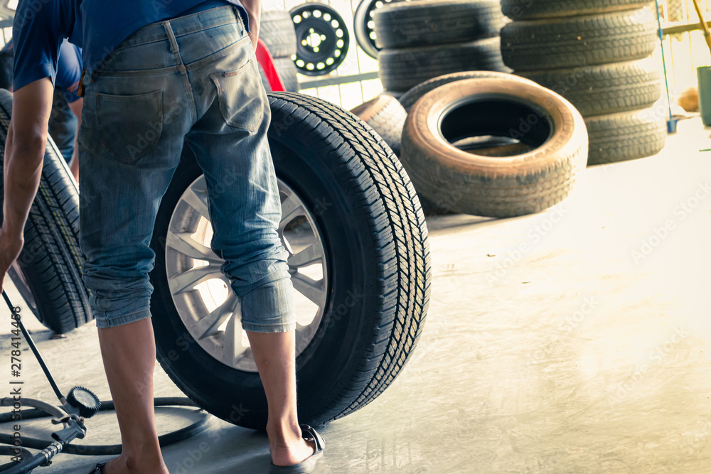 Professional repairman to repair the car wheels Professional repairman to repair the car wheels