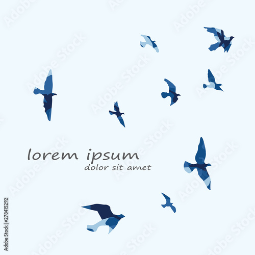 silhouette of a flock of flying birds