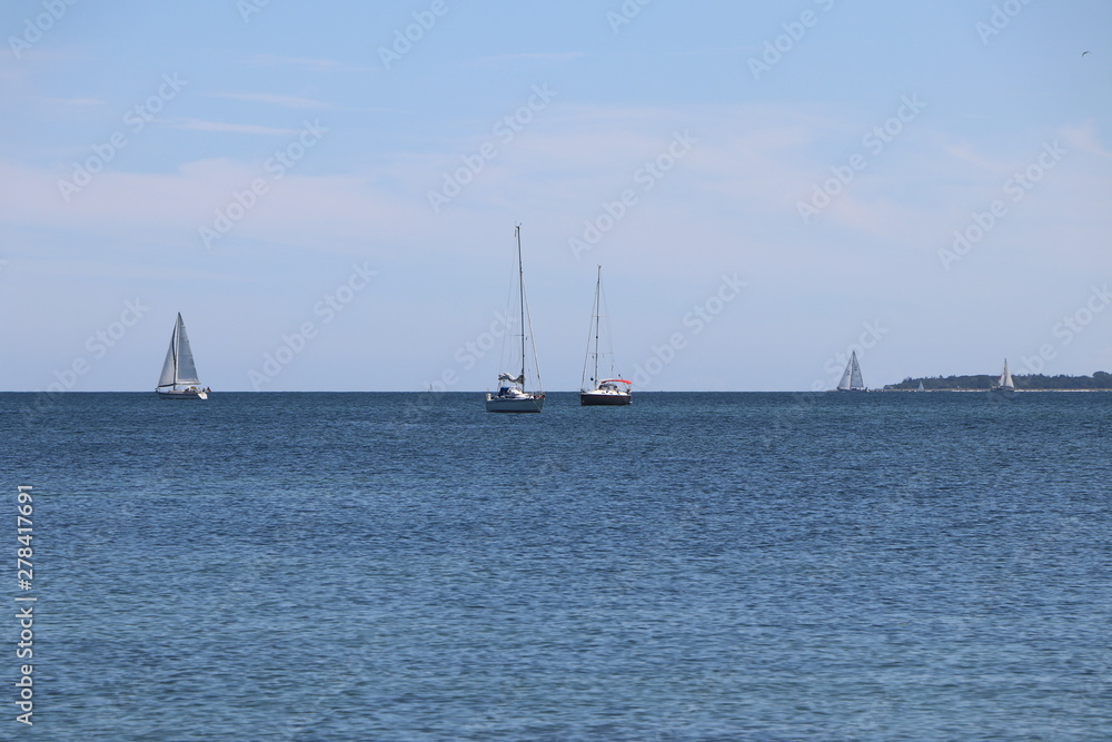 Sailing boats on the Baltic Sea under blue sky in the summer, copy space