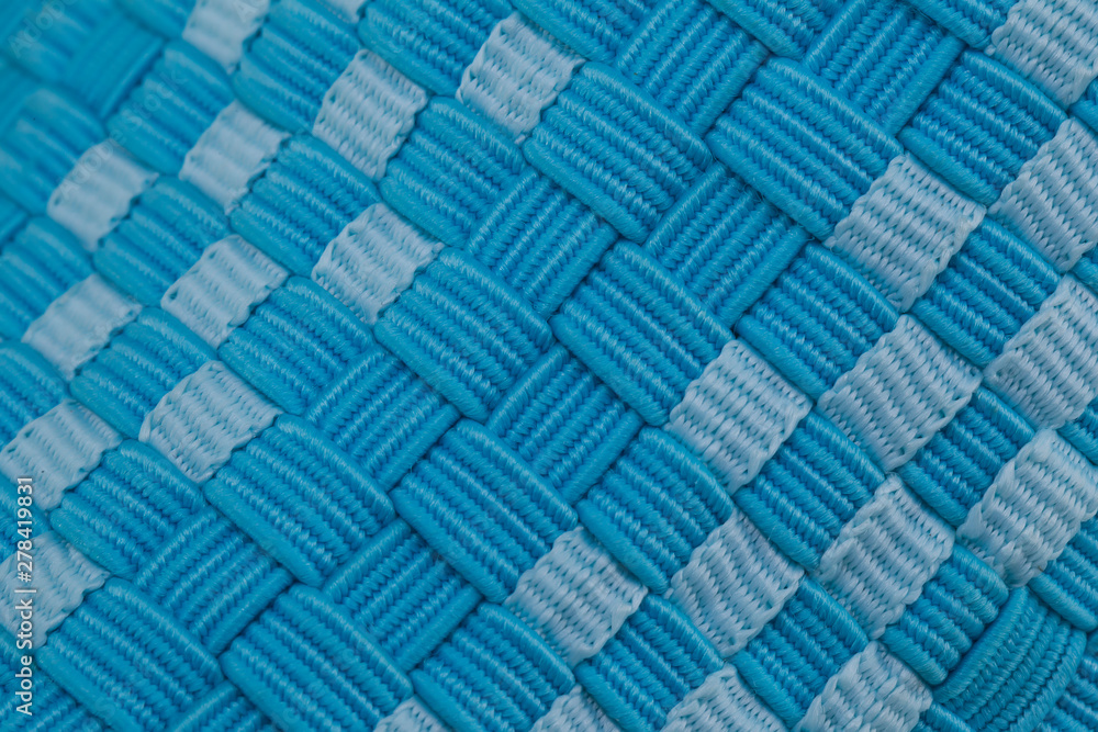 Fragment of a blue fabric sneaker. The texture of the material of sports shoes Fragment of a blue fabric sneaker. The texture of the material of sports shoes