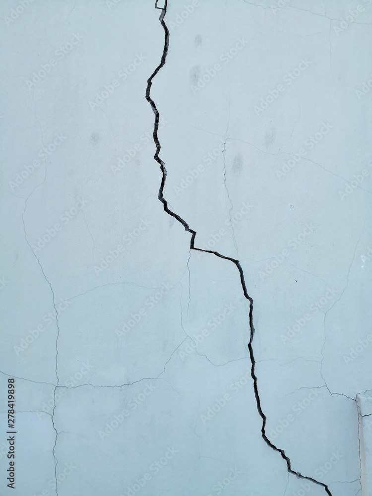 Crack in white wall, settlement crack Crack in white wall, settlement crack