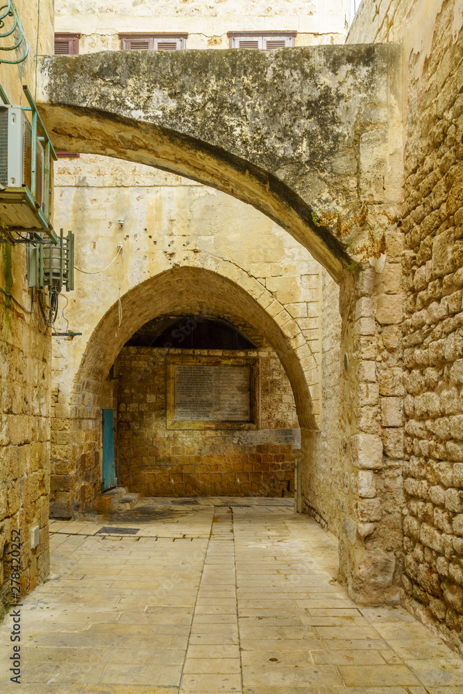 Alley with historic tablet, in the old city of Acre