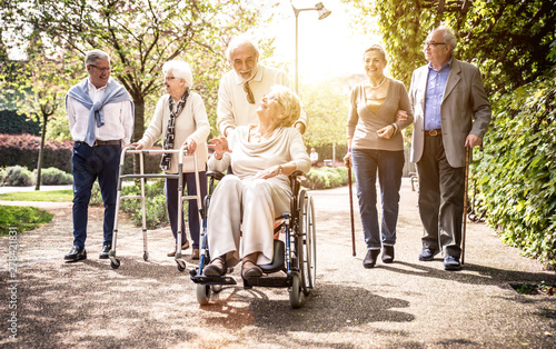 Group of old people walking outdoor photo