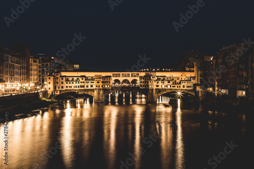 Ponte Vecchio and the buildings close by at night reflecting on the river Arno. Florence, Italy. © Cristina Jurca