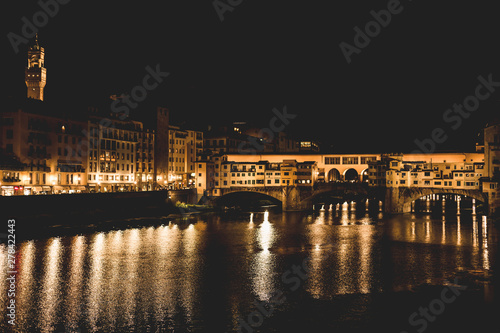 Ponte Vecchio and the buildings close by at night reflecting on the river Arno. Florence, Italy. © Cristina Jurca