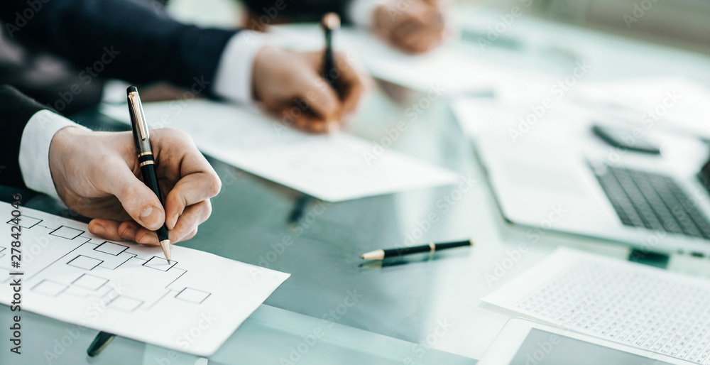 closeup of business team is working with the financial schedules closeup of business team is working with the financial schedules