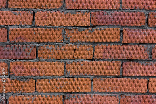 Fragment of an old brick wall close up.