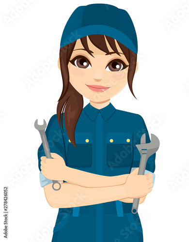 Female auto mechanic holding different repair tools