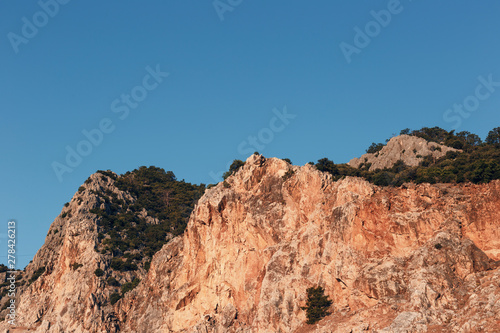 Beautiful landscape in the mountain view. Beautiful view of the Taurus mountains in the morning sun against the blue sky. Kemer, Turkey.
