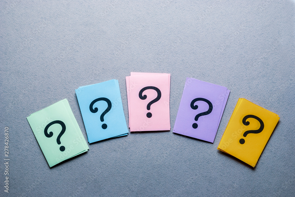 Row of different colored cards with question marks Row of different colored cards with question marks
