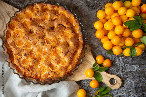 yellow plum mirabelle. Plum pie on a dark background. Summer fruit season.harvest.