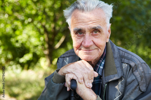 Elderly poor man thinks about life