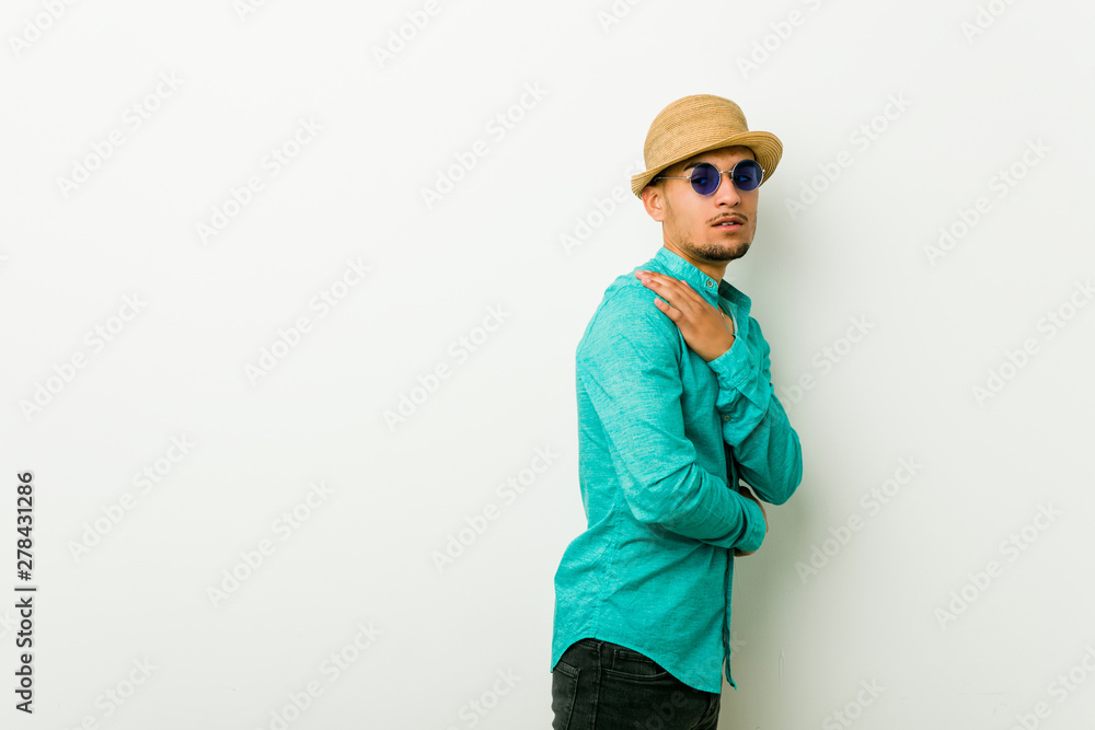 Young hispanic man wearing a summer clothes scared and afraid. Young hispanic man wearing a summer clothes scared and afraid.