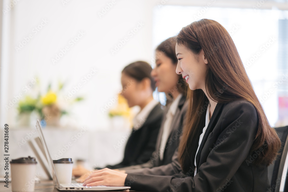 Asian businessmen are working with laptops in the office. Asian businessmen are working with laptops in the office.
