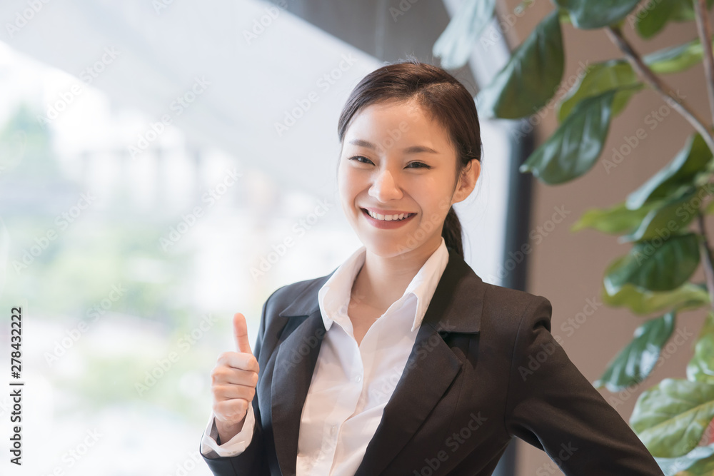 Potrait Asian businesswoman thumbs up. Potrait Asian businesswoman thumbs up.