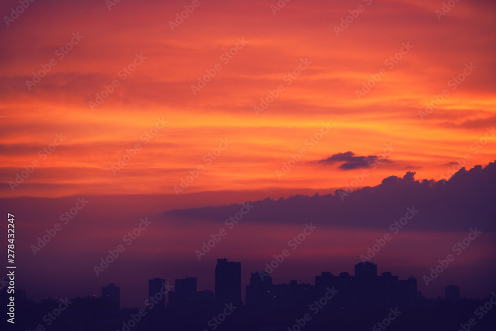 Dramatic sunset over the evening city.