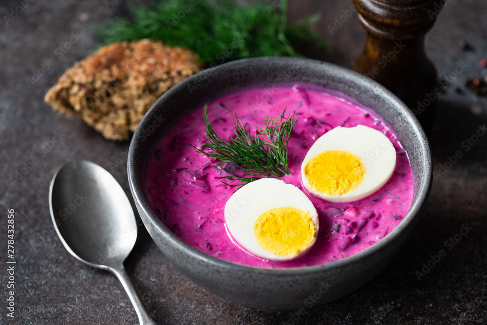 Tasty cold beetroot soup with boiled egg in a bowl. Russian, Polish cuisine Tasty cold beetroot soup with boiled egg in a bowl. Russian, Polish cuisine