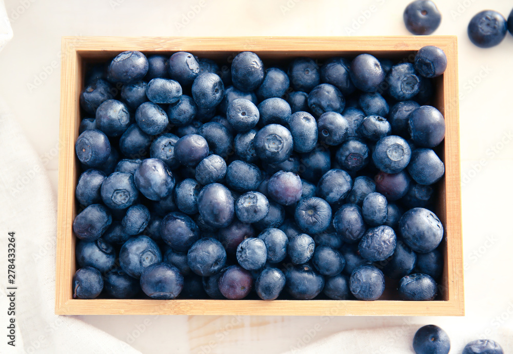 Box with fresh blueberry on table, top view Box with fresh blueberry on table, top view