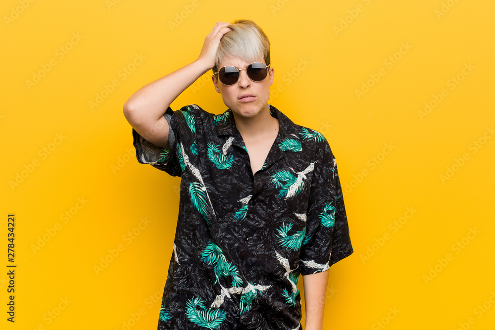 Young curvy woman wearing a summer look tired and very sleepy keeping hand on head.