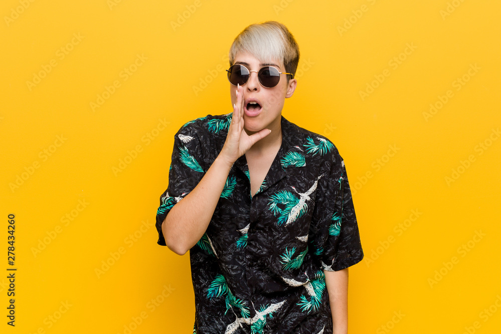 Young curvy woman wearing a summer look is saying a secret hot braking news and looking aside Young curvy woman wearing a summer look is saying a secret hot braking news and looking aside