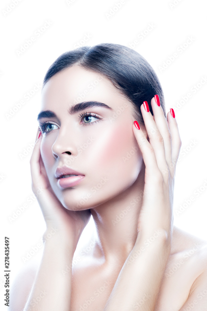 portrait of young beauty fashion model woman with healthy perfect skin, natural make-up, hands near face, red nail manicure. Skincare facial treatment concept portrait of young beauty fashion model woman with healthy perfect skin, natural make-up, hands near face, red nail manicure. Skincare facial treatment concept