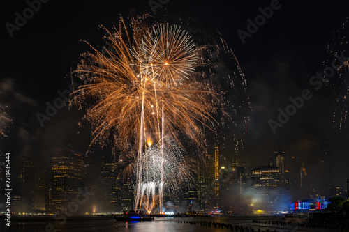 Macy's 4th of July Independence Day Fireworks show on east river with Lower Manhattan Skyline