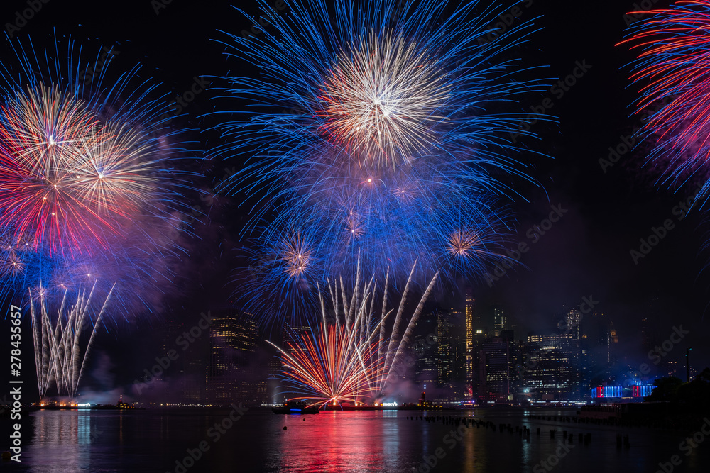 Macy's 4th of July Independence Day Fireworks show on east river with Lower Manhattan Skyline Macy's 4th of July Independence Day Fireworks show on east river with Lower Manhattan Skyline