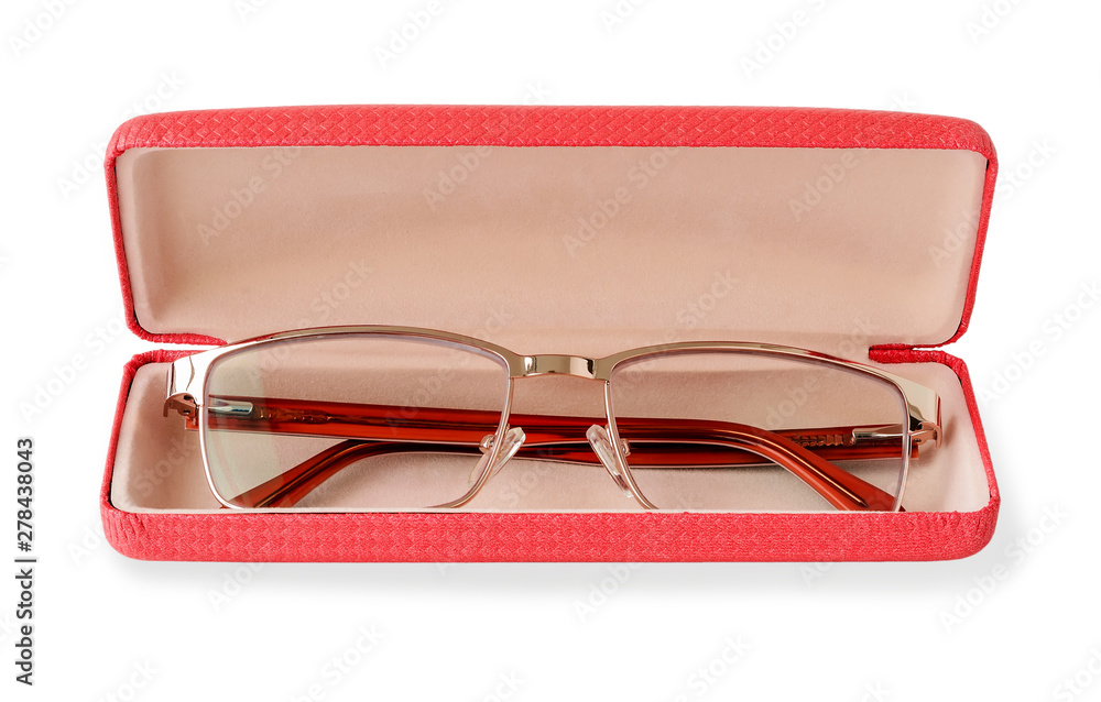 Glasses for sight with a golden rim in a pink glasses case. Golden eye glasses for reading and computer work. Myopia, hyperopia and vision correction. Isolated. Glasses for sight with a golden rim in a pink glasses case. Golden eye glasses for reading and computer work. Myopia, hyperopia and vision correction. Isolated.